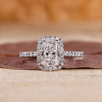 Elongated cushion cut diamond ring in white gold ring.