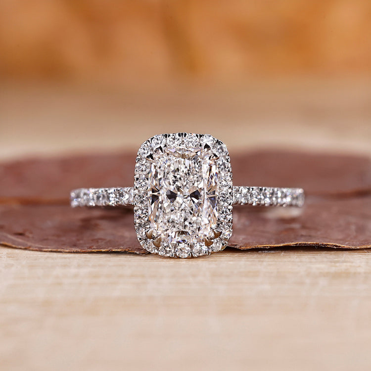 Elongated cushion cut diamond ring in white gold ring.