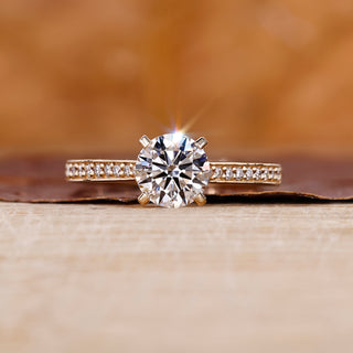 Yellow gold engagement ring with round diamond engagement ring.