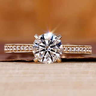 Yellow gold engagement ring with round diamond engagement ring.