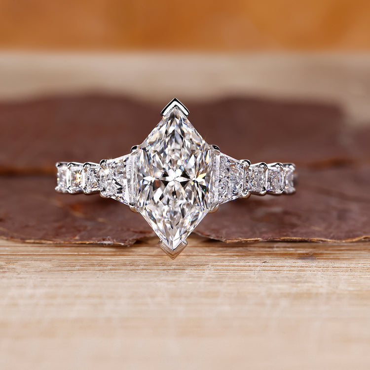 Dutch Marquise Ring paired with trapezoid brilliant cut side stones.