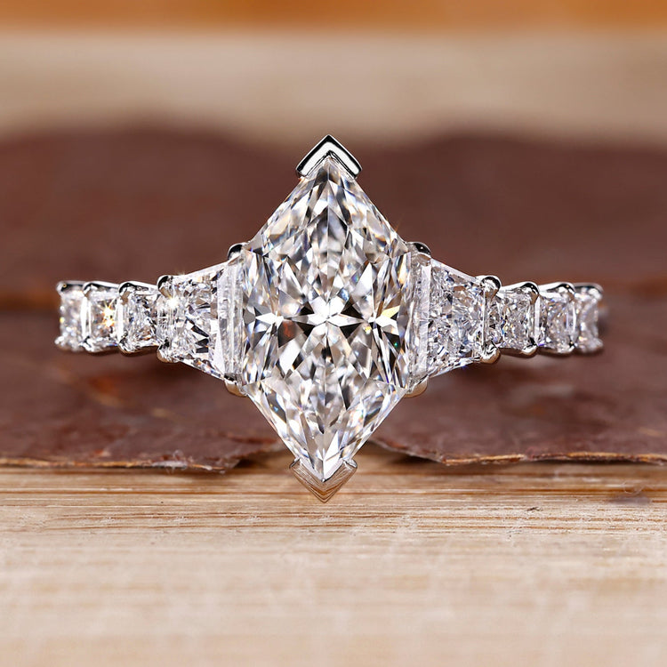 Dutch Marquise Ring paired with trapezoid brilliant cut side stones.