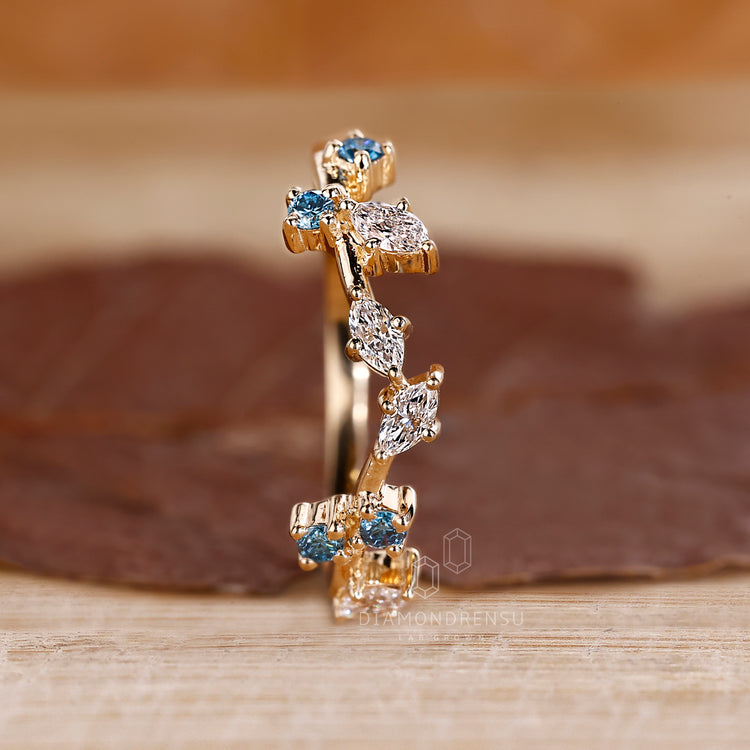 Yellow Gold Wedding Band featuring marquise cut diamonds.
