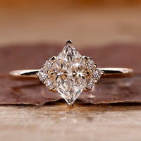Dutch marquise solitaire diamond ring with 8 claw prong setting.