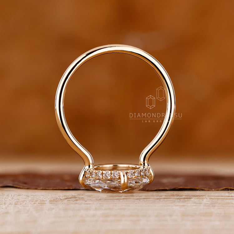 Open Gallery Ring in yellow gold with lab grown diamond.