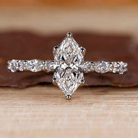 Marquise cut engagement ring in white gold.