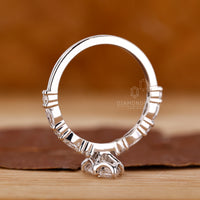 Shared prong ring with round cut diamonds.