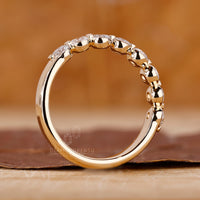 Yellow gold wedding band with lab diamonds.