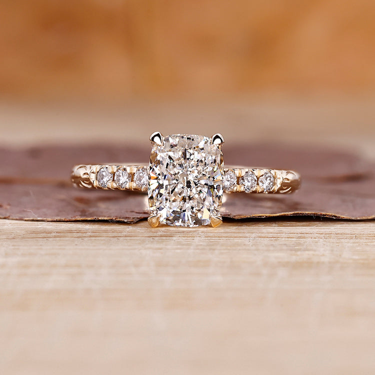 Cushion cut diamond ring with hidden halo ring.