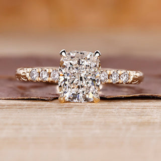 Cushion cut diamond ring with hidden halo ring.
