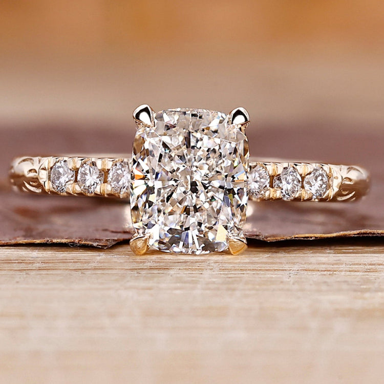 Cushion cut diamond ring with hidden halo ring.
