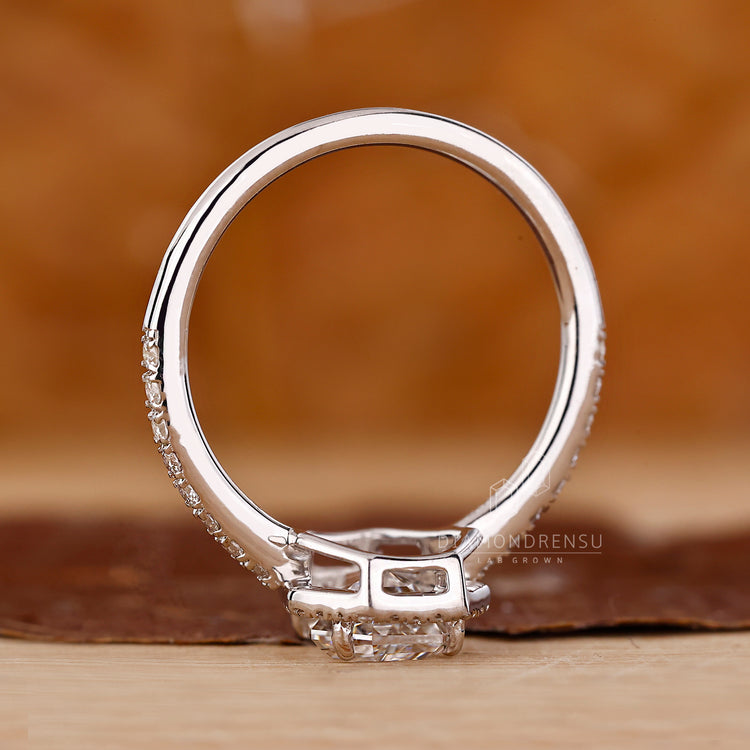 Coffin diamond ring round diamond halo pave style.