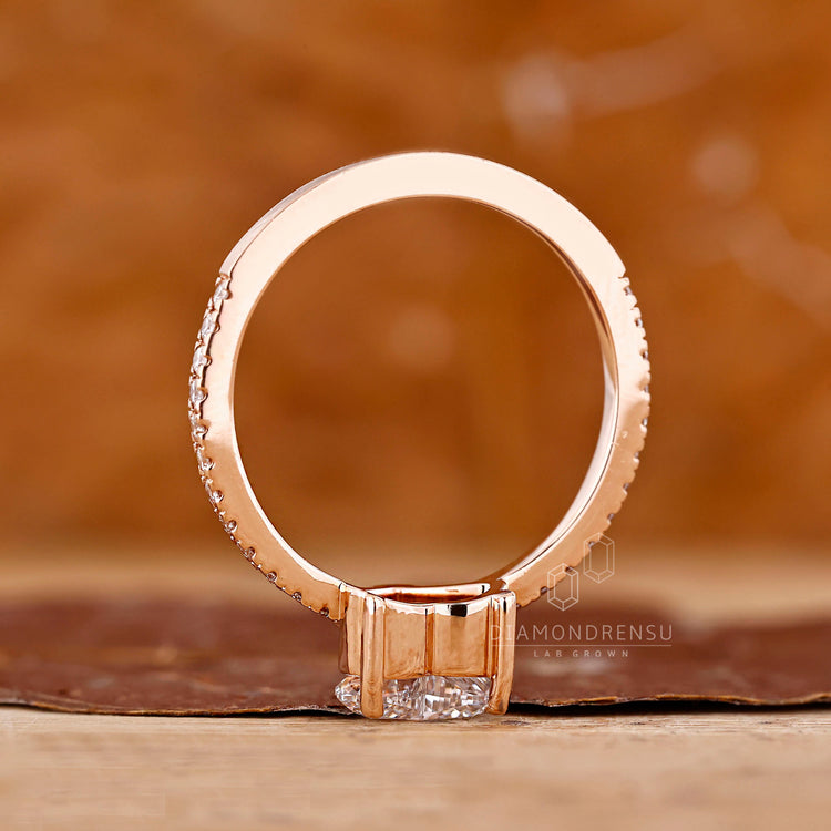 Elegant heart cut diamond ring with pave accents.