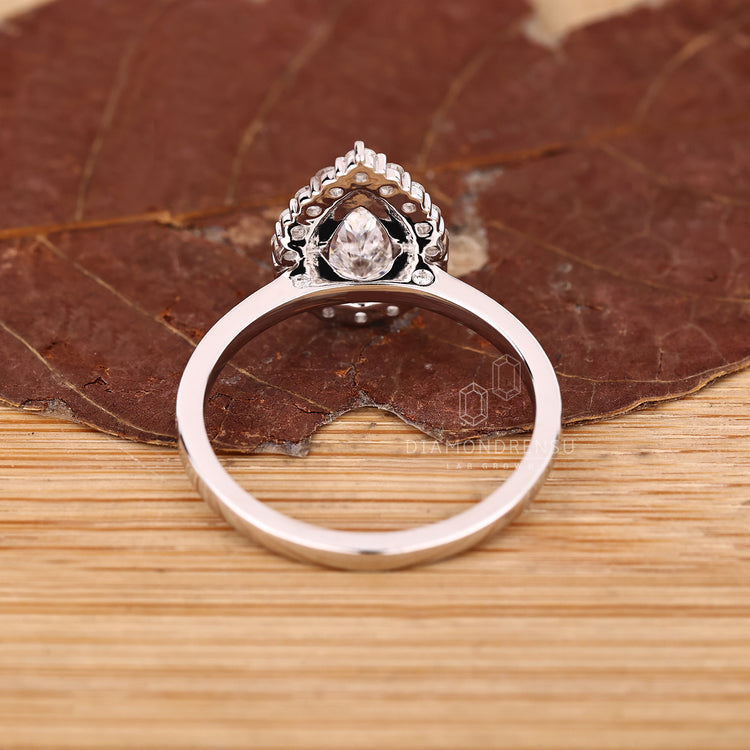 IGI certified pear diamond ring three claw prong.