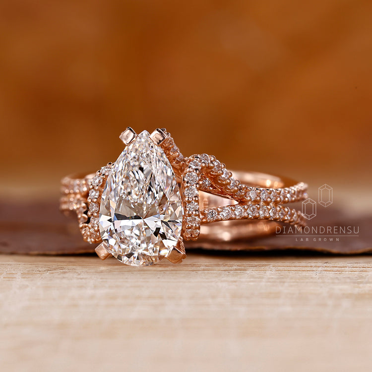 Lab grown pear diamond ring hidden halo pave style.