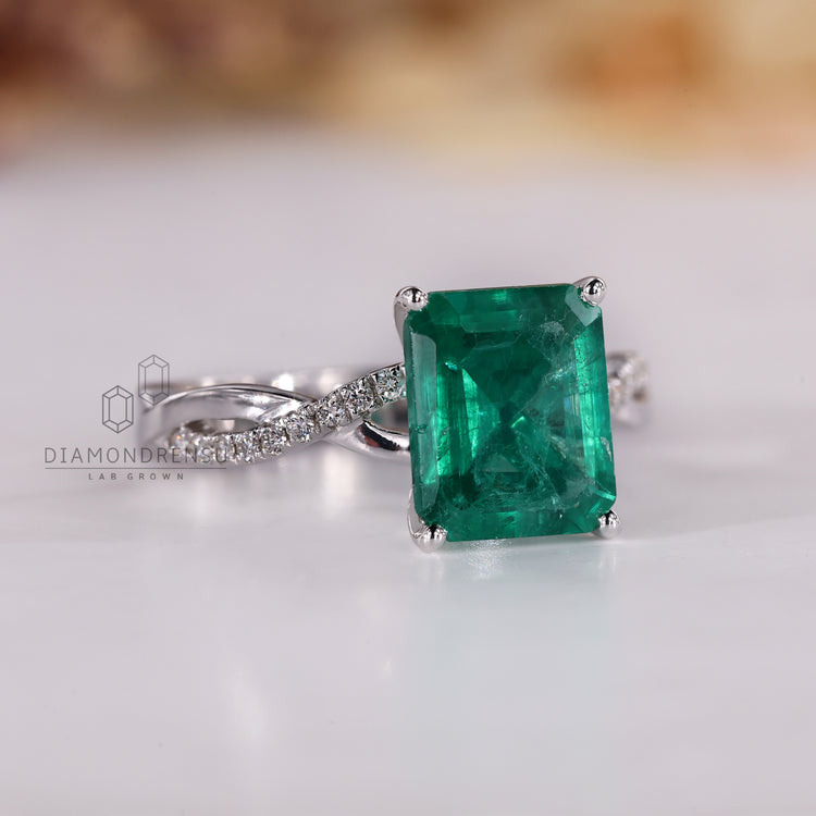 Four prong emerald cut gemstone ring setting.