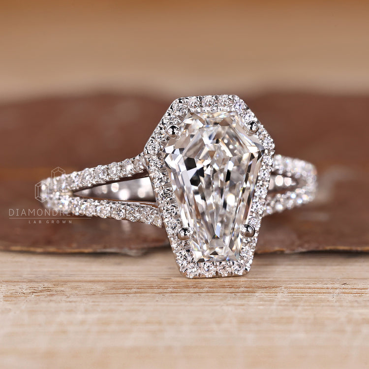 Halo coffin diamond ring split shank design.