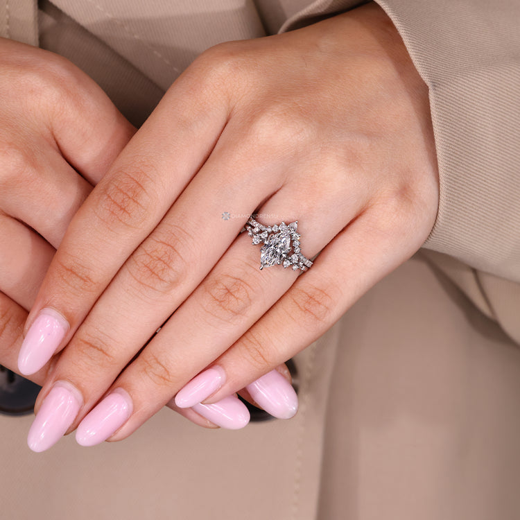 Marquise bridal set with round diamond wedding band.