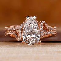 Pear cut diamond ring hidden halo double row pave set.