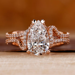 Pear cut diamond ring hidden halo double row pave set.