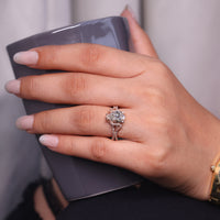 Pear cut ring double row pave hidden halo prong set.