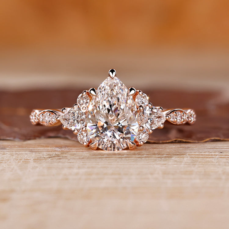 Pear cut diamond ring cluster muse marquise pave style.