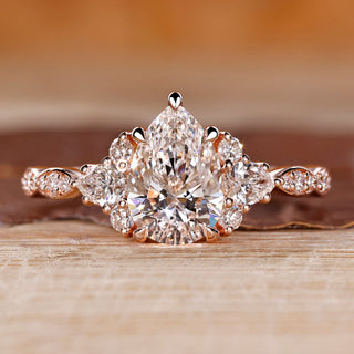 Pear cut diamond ring cluster muse marquise pave style.