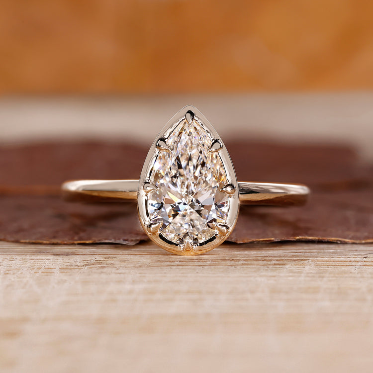 Pear cut diamond ring solitaire eight claw vintage.
