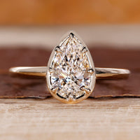 Pear cut diamond ring solitaire eight claw vintage.
