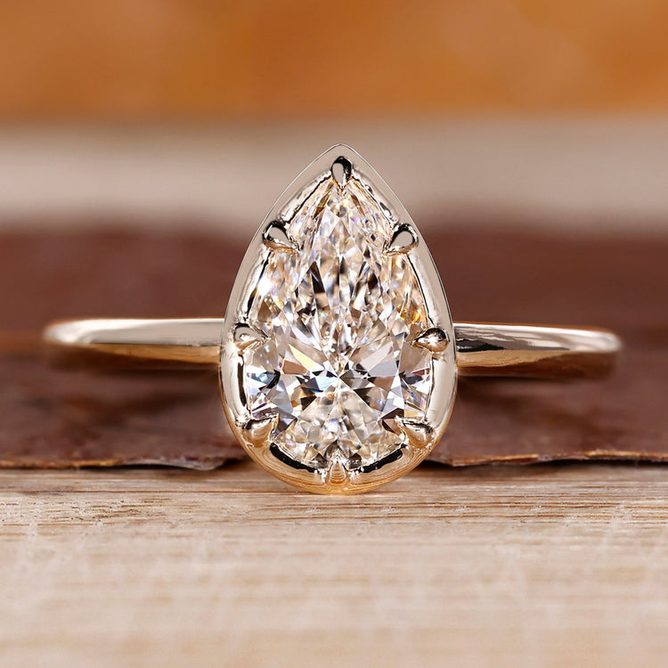 Pear cut diamond ring solitaire eight claw vintage.