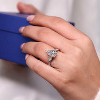Lab grown pear cut diamond ring in cathedral style.
