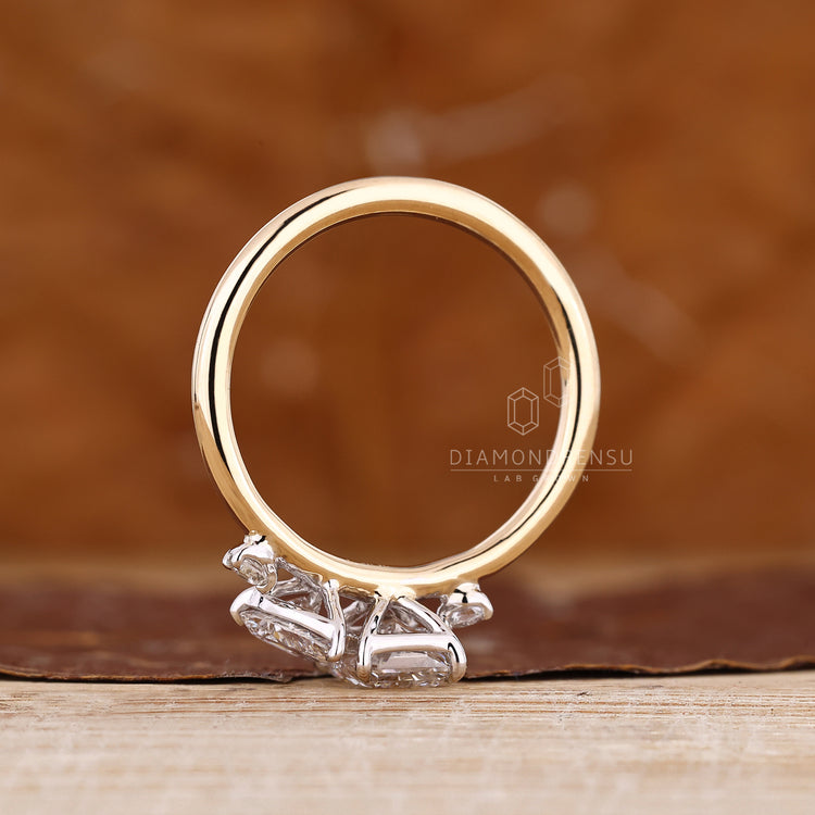 Handmade pear radiant ring split shank claw prong.