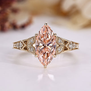 Marquise diamond ring with round side stones.