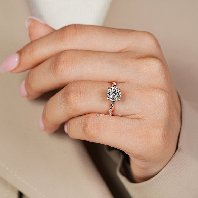 Portuguese diamond ring with round diamond accents.