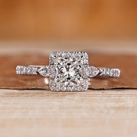 Princess cut diamond ring pear side stones.