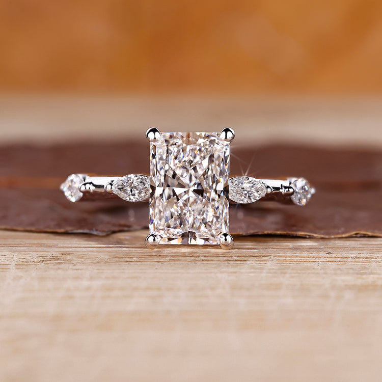 Distance pave hidden halo radiant cut diamond ring.