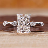 Distance pave hidden halo radiant cut diamond ring.