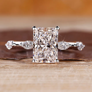 Distance pave hidden halo radiant cut diamond ring.