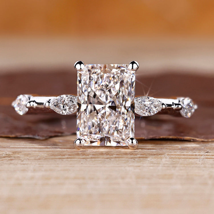 Distance pave hidden halo radiant cut diamond ring.