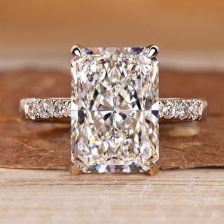 Radiant cut diamond ring with hidden halo and pave style.