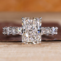 Radiant cut lab diamond ring in u prong micro pave.