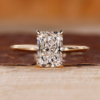 Radiant cut diamond engagement ring with round hidden halo.