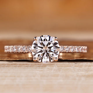 Round cut diamond ring with round diamond pave style.