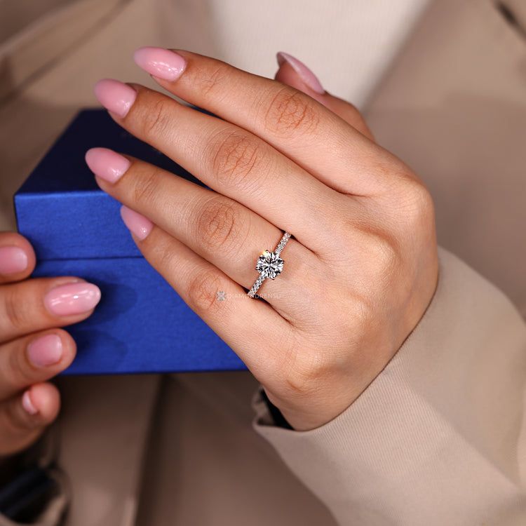 Round cut ring with four prong setting.
