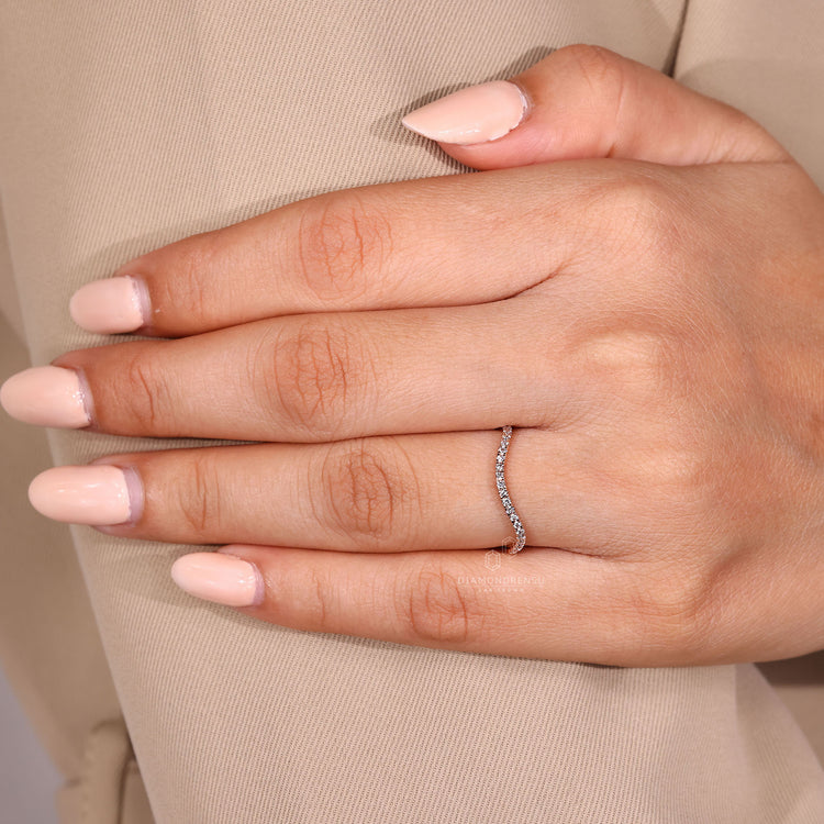 Round cut band half eternity ocean wave design.