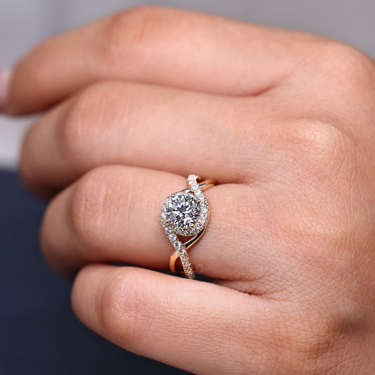 Round cut ring twisted shank halo four prong set.