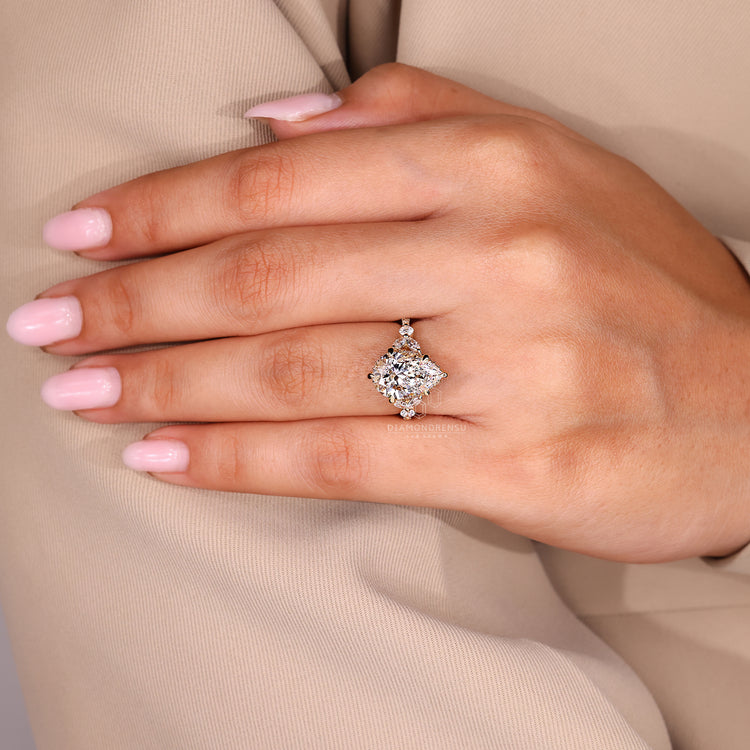 Tulip setting pear cut diamond ring design.