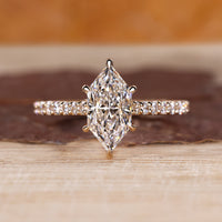 Dutch marquise diamond ring with round diamond pave style.