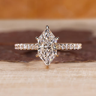 Dutch marquise diamond ring with round diamond pave style.