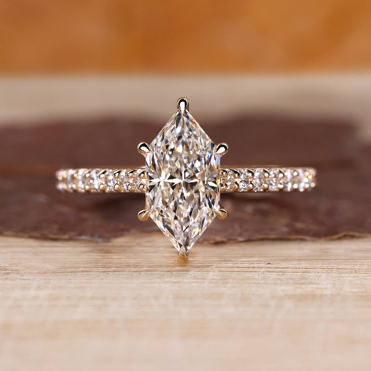 Dutch marquise diamond ring with round diamond pave style.